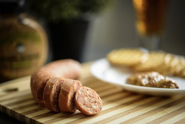 Boudin sausage sliced into rounds showing rice and pork filling