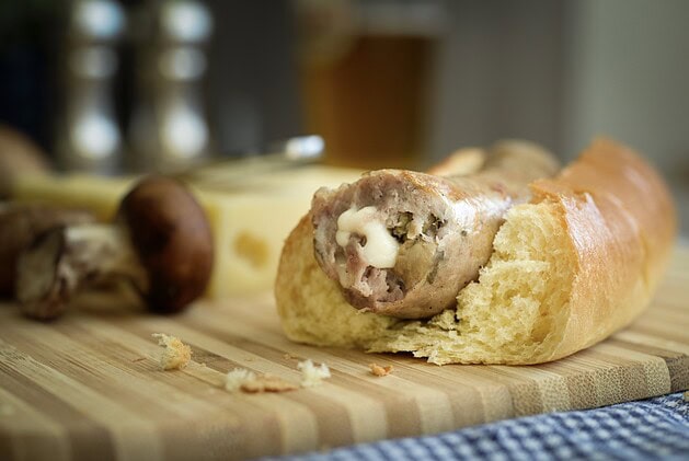 Mushroom Swiss bratwurst in a bun with mushrooms and Swiss cheese