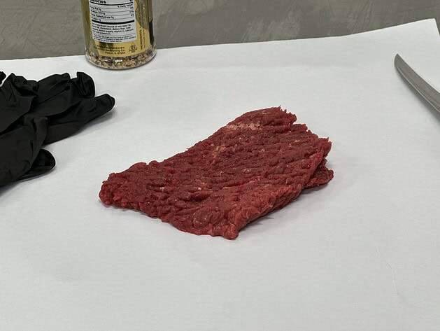 Raw beef cube steak on butcher paper