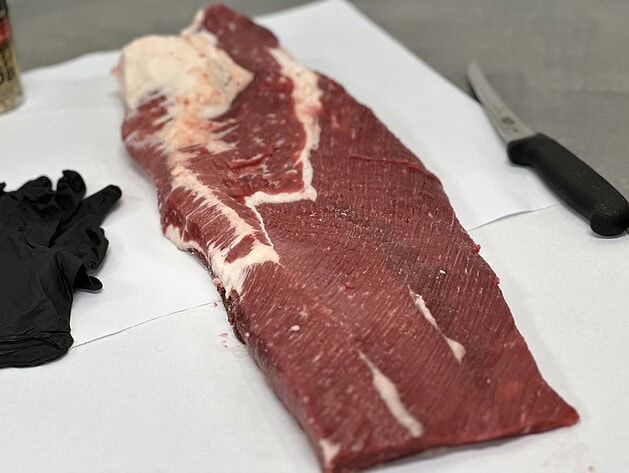 Raw whole packer brisket on butcher paper